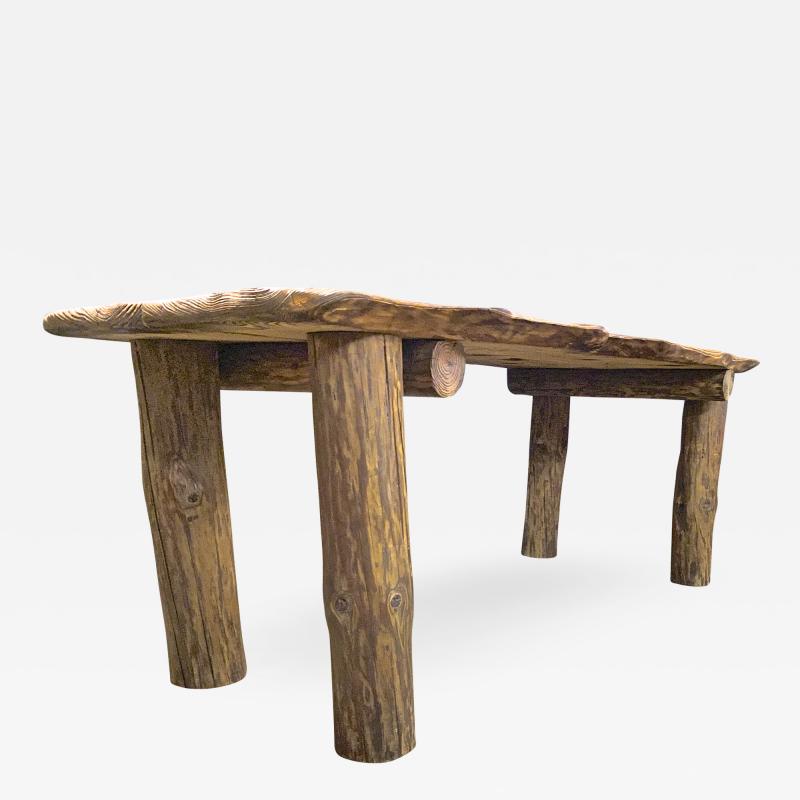 Brutalist awesome sand blasted organic dinning table with log legs