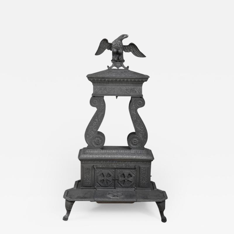 CAST IRON TWO COLUMN PARLOR STOVE WITH EAGLE FINIA