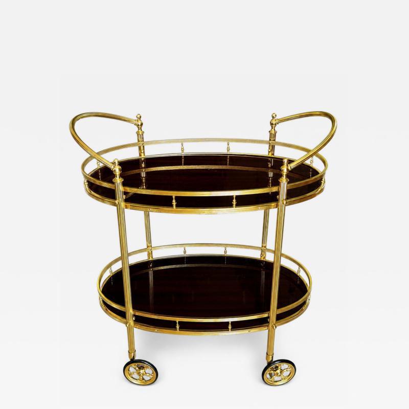 CIRCA 1960 TWO TIERED OVAL BRASS SERVING TROLLEY