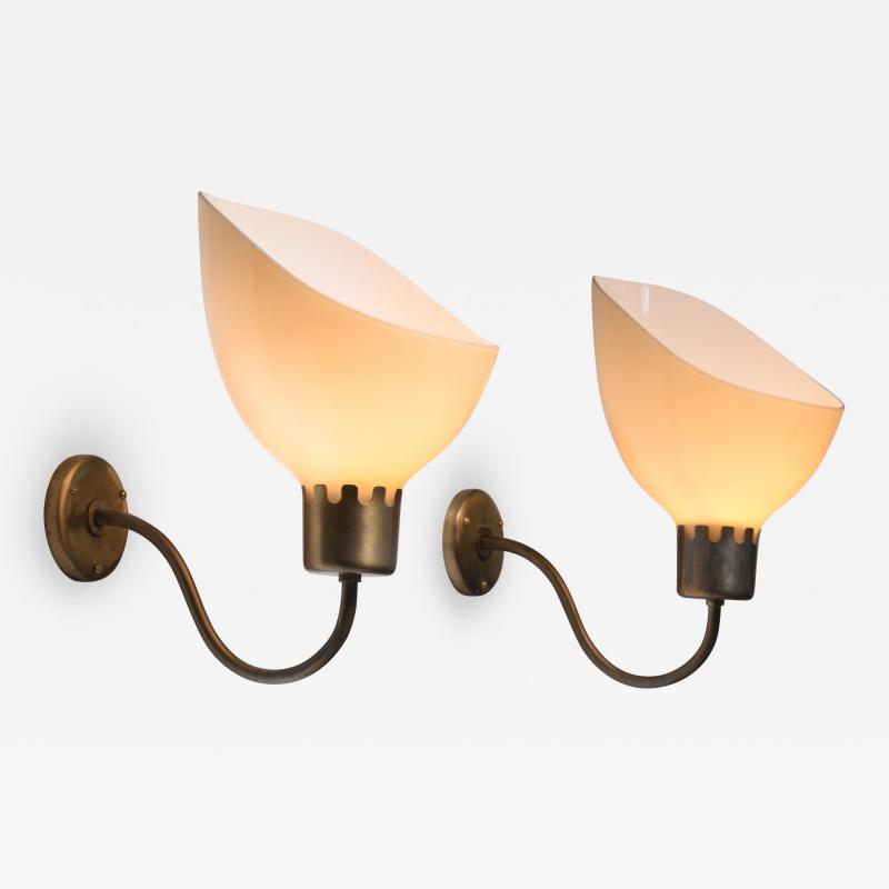 Carl Axel Acking Pair of large Carl Axel Acking brass and yellow glass wall lamps