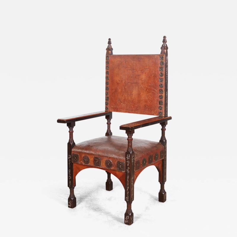 Carlo Bugatti CARLO BUGATTI PEWTER INLAID AND WALNUT UPHOLSTERED ARMCHAIR