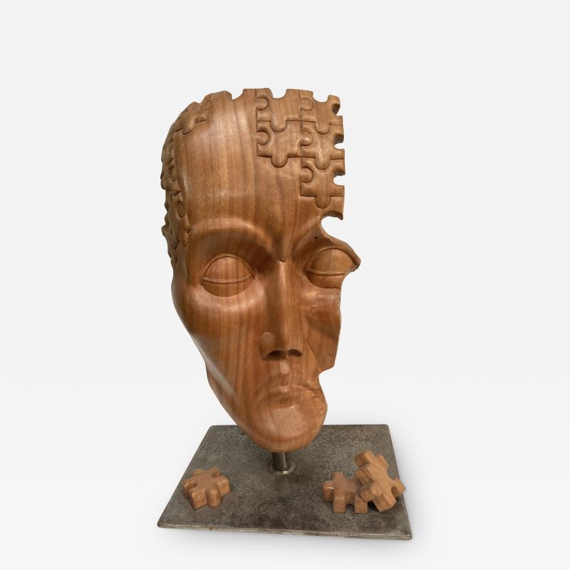 Carved wood puzzle head sculpture