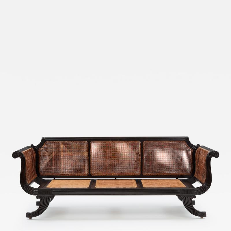 Ceylonese Ebony Framed Sofa in Regency Style Circa 1830 Caned seats and back 