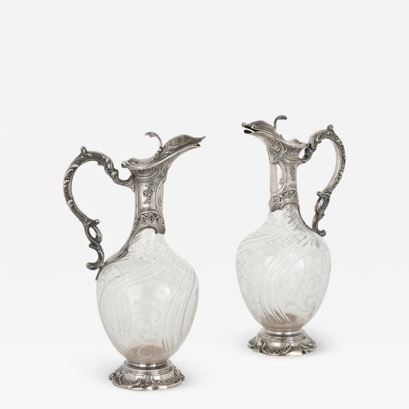 Charles Hack Pair of Rococo style cut glass and silver jugs by Charles Hack