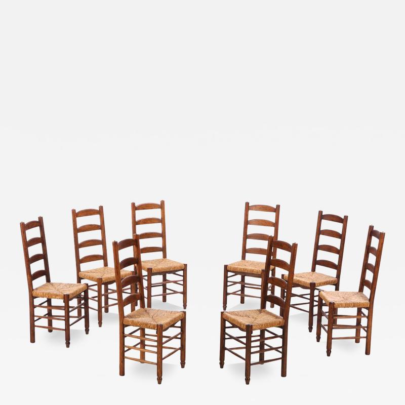 Charlotte Perriand Eight French oak rush dining chairs in manner of Charlotte Perriand C 1950 