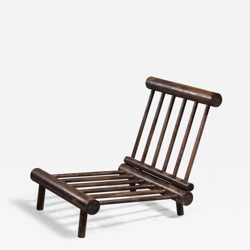 Charlotte Perriand Low chauffeuse fireside lounge chair in elm for Les Arcs
