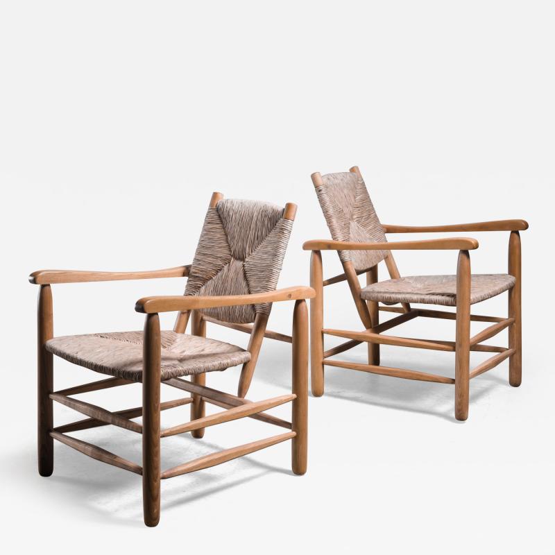 Charlotte Perriand Pair Charlotte Perriand model no 21 lounge chairs