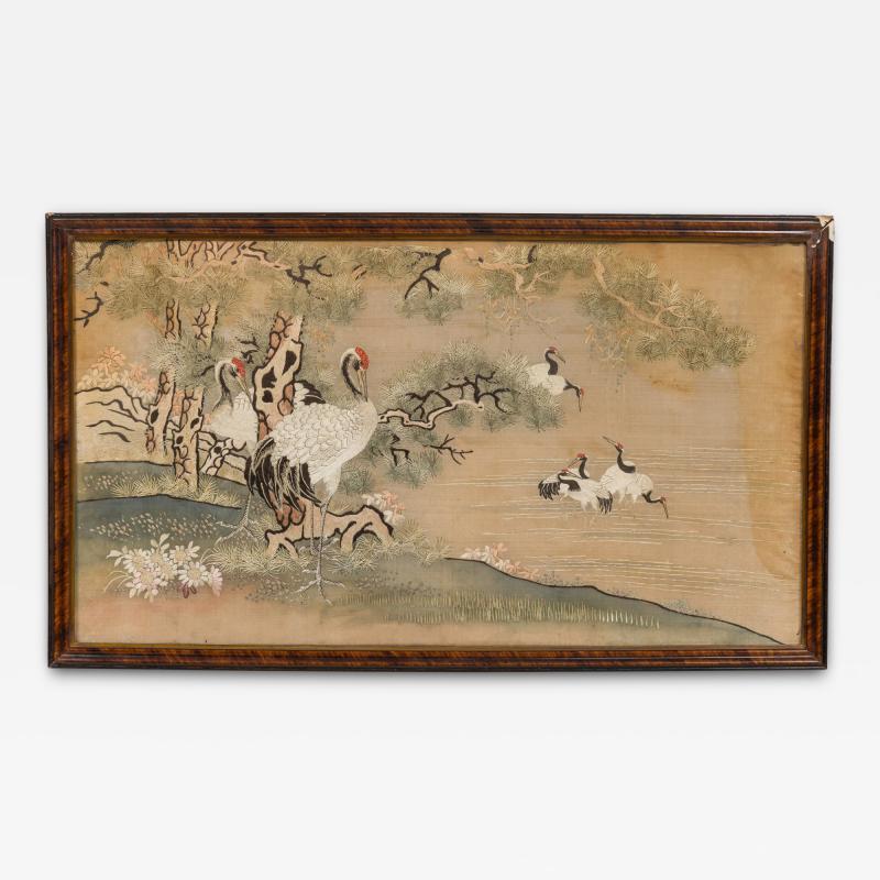 Chinese silk embroidery of herons on land and lake in a mahogany frame