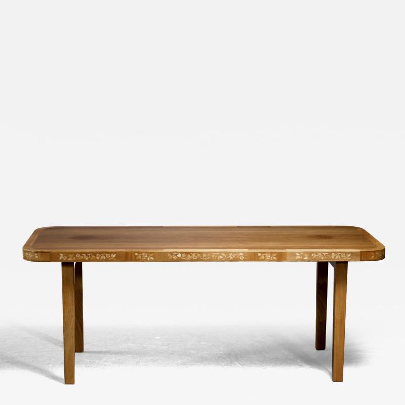 Coffee table with intarsia decoration