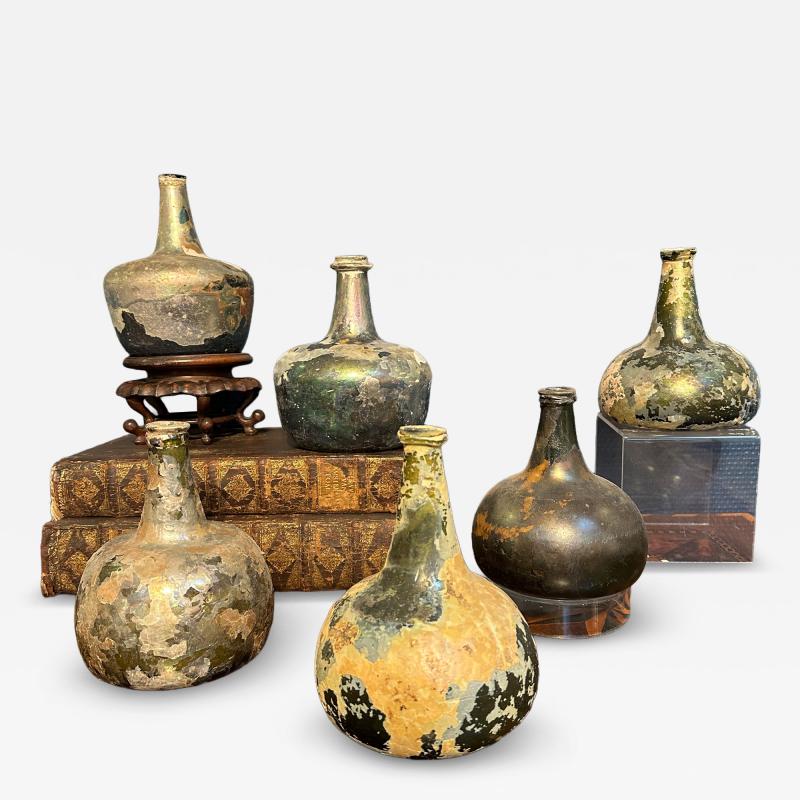 Collection of 17th and 18th century iridescent wine bottles