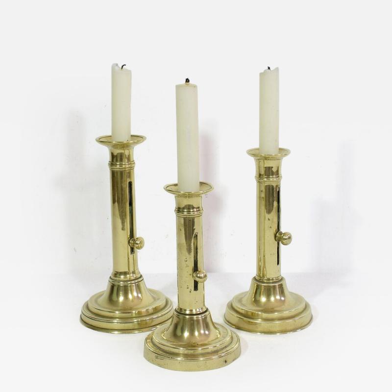 Collection of 3 French 19th Century Brass Bistro Push Up Candleholders