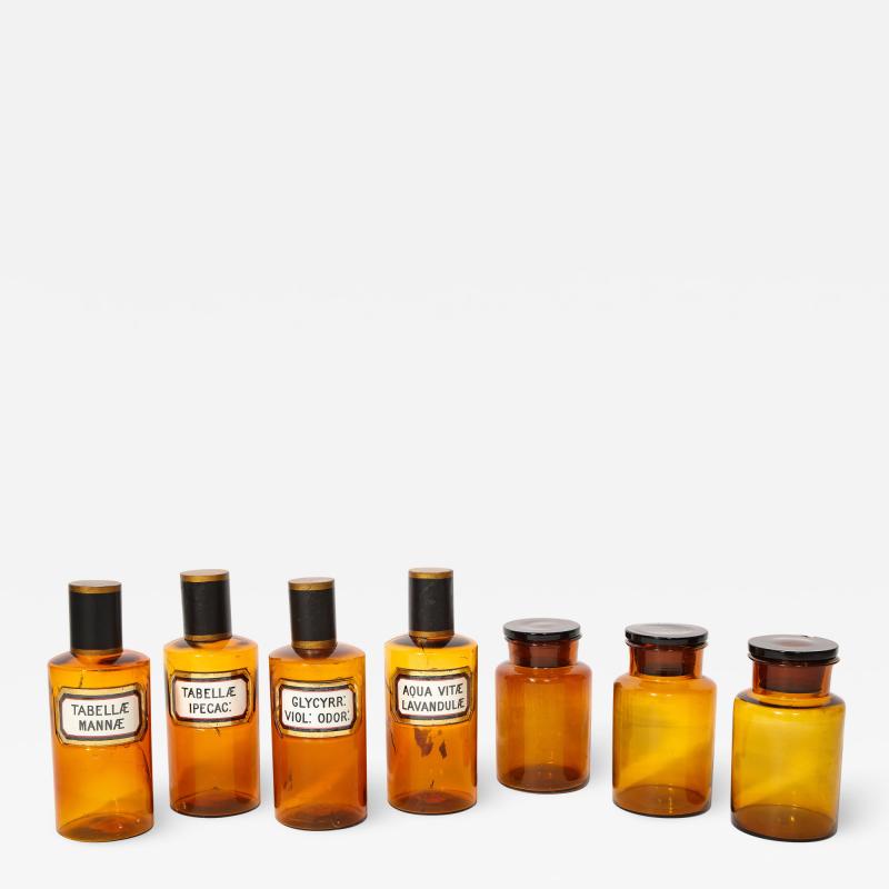 Collection of 7 Amber Glass Apothecary Jars