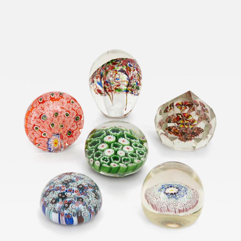 Collection of six glass multicoloured paperweights