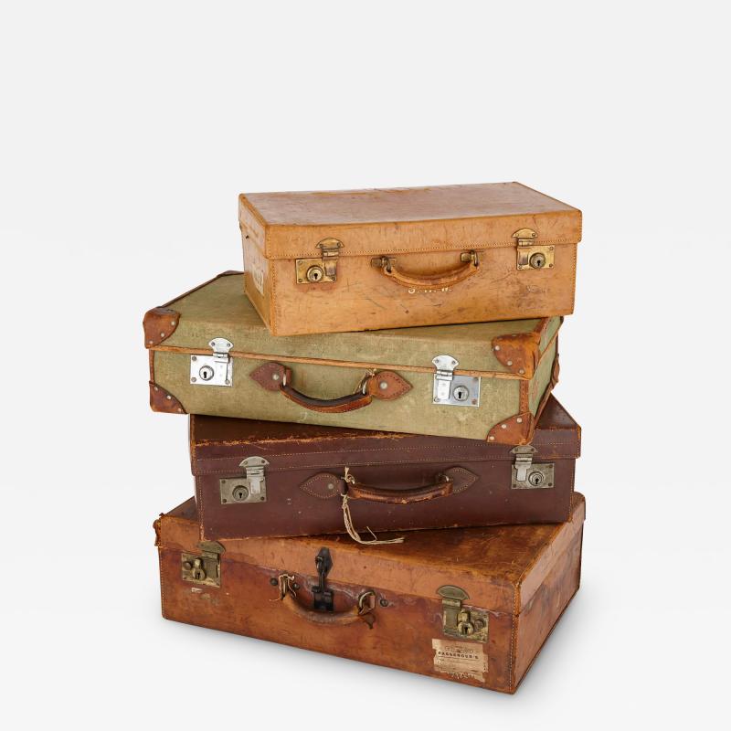 Collection of vintage luggage a set of four English travel cases