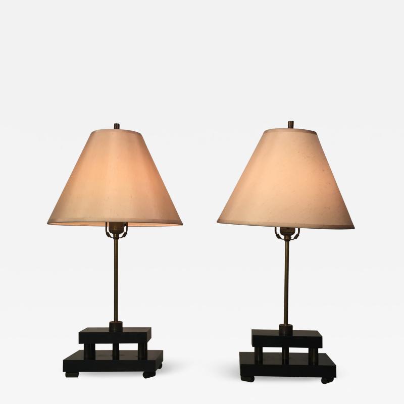 Donald Deskey PAIR OF ART DECO BLACK BAKELITE AND SOLID BRONZE MACHINE AGE LAMPS