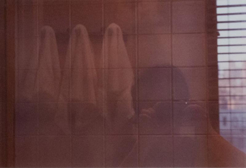 Double Exposure Of A Person In A Bathroom