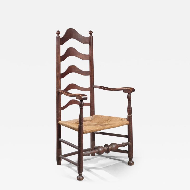 EARLY LADDER BACK ARMCHAIR