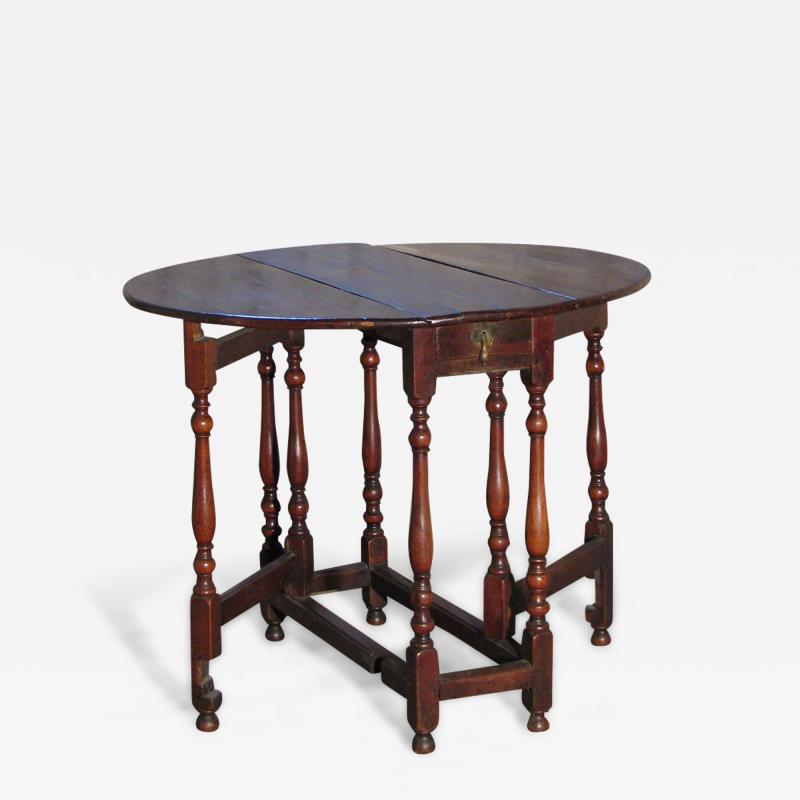 Early 18th Century English Walnut Oval Dropleaf Gateleg Table