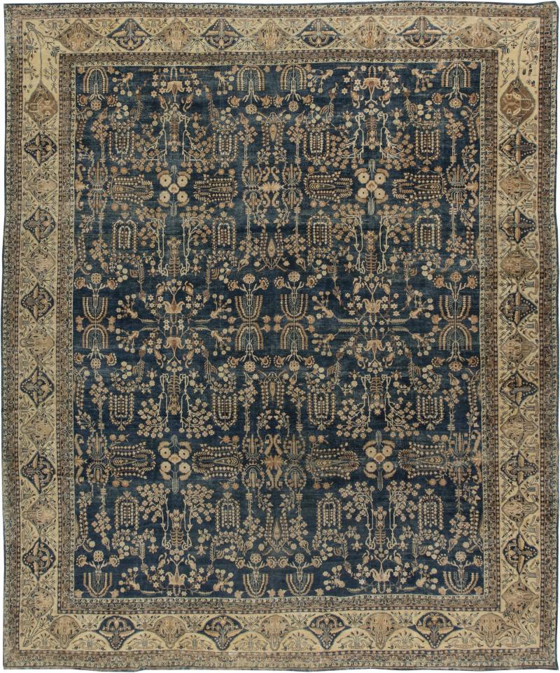 Early 20th Century Persian Kirman Navy Blue and Camel Wool Rug
