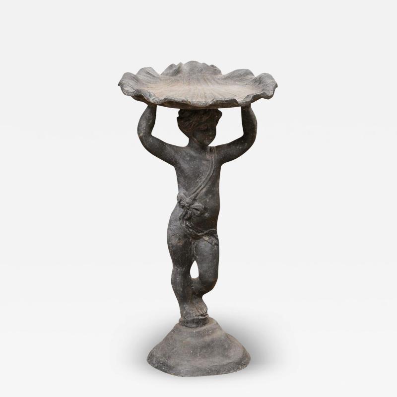 English Iron Greco Roman Style Standing Cherub Carrying a Sea Shell Bird Bath