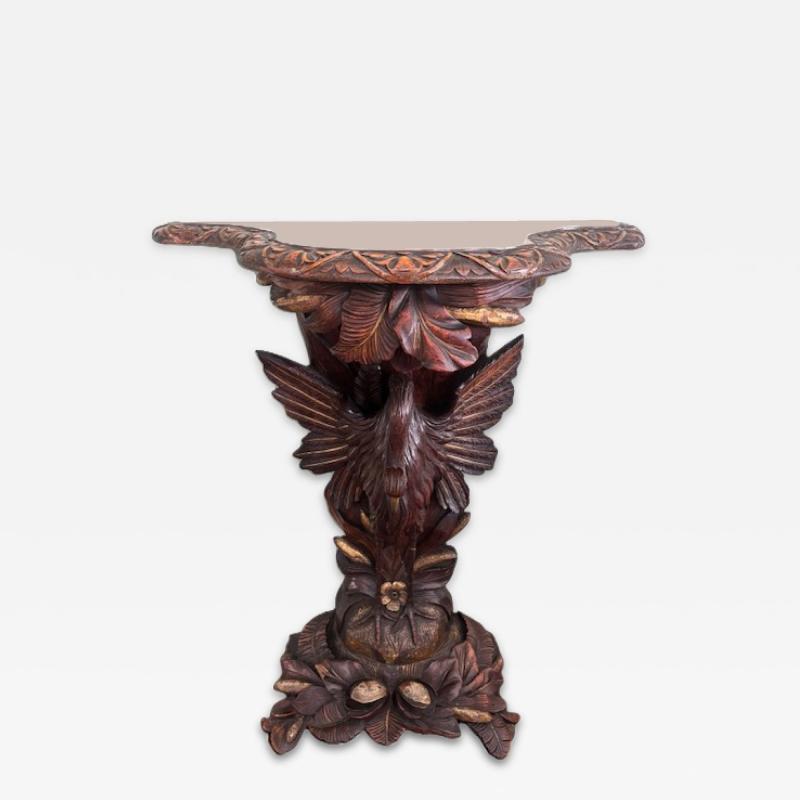 English Regency console with a carved bird floral base over a shaped top