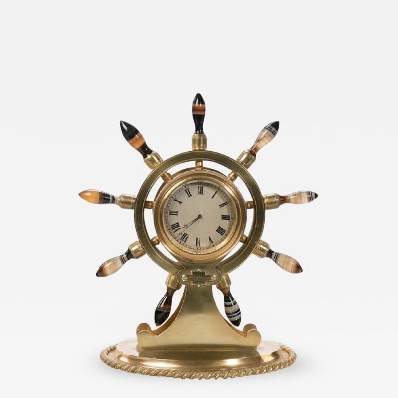 English gilt metal clock in the form of a ships wheel