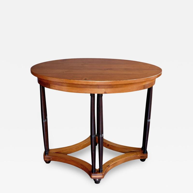 English pine oval center side table raised on columnar supports