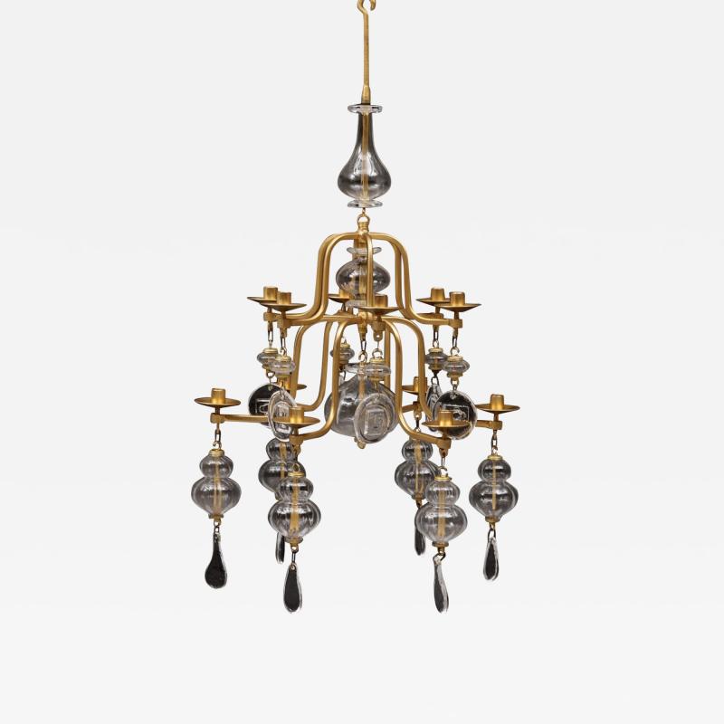 Erik H glund A gilt wrought iron and glass chandelier by Erik Hoglund for Boda 