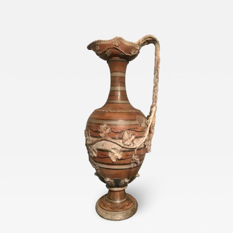 Etruscan style terracotta ewer with wine leaf motifs