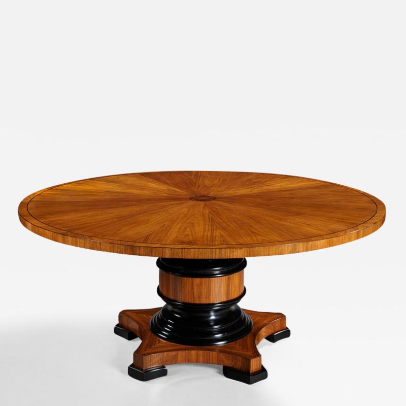 FINE QUALITY 5 1 2 FT CIRCULAR OLIVE WOOD AND EBONY DINING TABLE