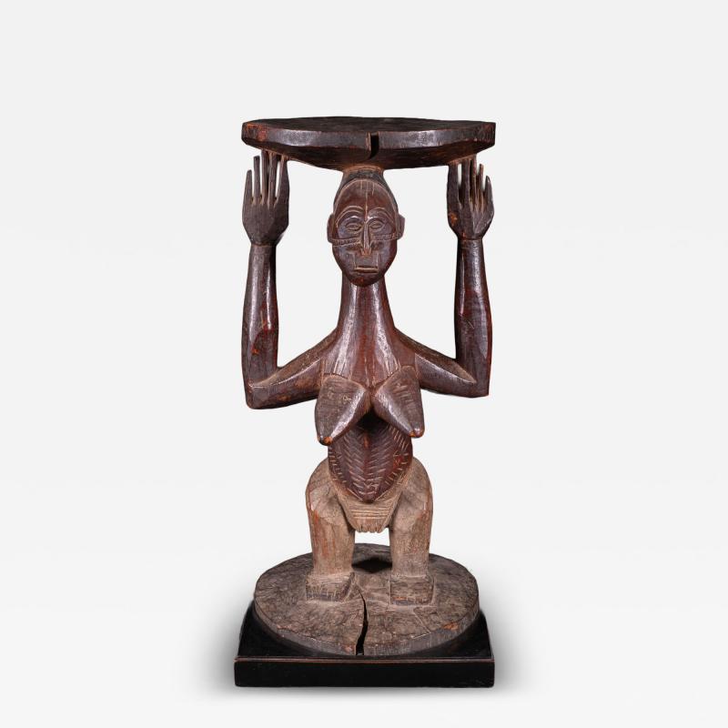 Female Caryatid standing Figure on a circular base supporting a circular stool
