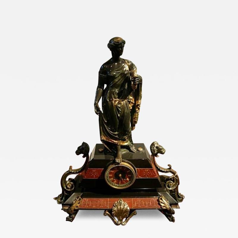 Figure mounted Second French Empire mantel clock in black patinated bronze