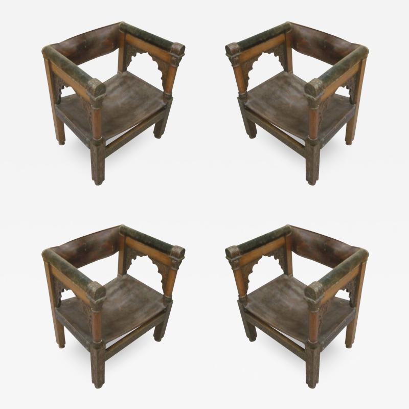 Four Franco Islamic Carved Wood and Leather Lounge Chairs