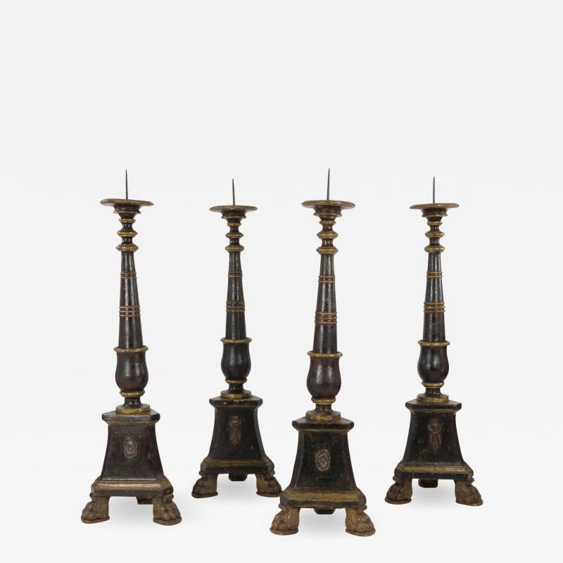 Four Large Scale 17th Century Black Gilt Painted Pricket Stands