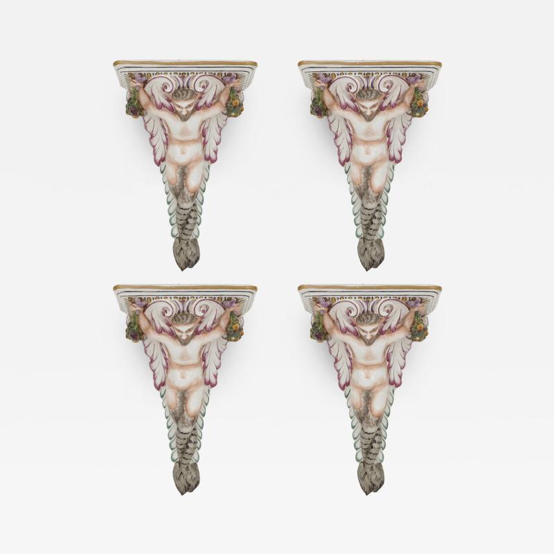 Four decorative porcelain wall brackets of satyr form