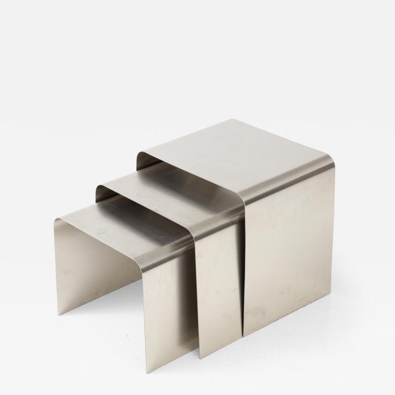 Fran ois Monnet Rare set of three nesting tables rendered in bent brushed stainless steel 