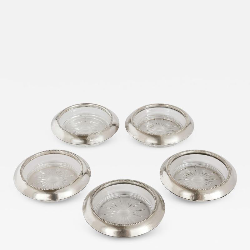 Frank Whiting Collection of five American silver and glass coasters by Frank M Whiting Co 