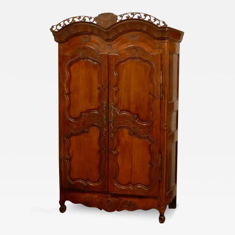 French Late 18th Century Cherry Armoire from Rennes with Hand Carved D cor