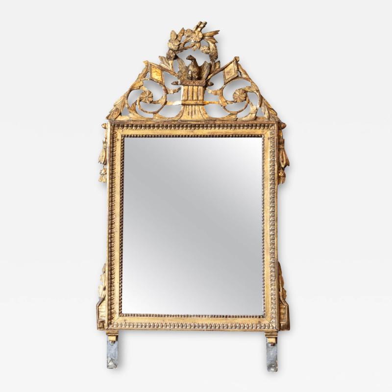 French Louis XVI Period 1790s Giltwood Mirror with Carved Bird and Flags