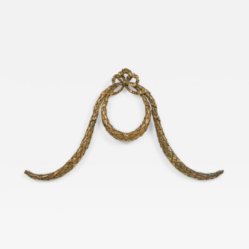 French bronze wall mounted ornament of a wreath with bow knot top