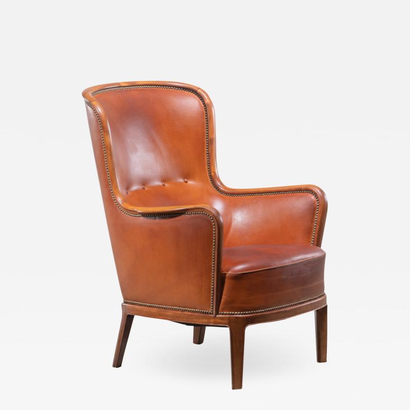 Frits Henningsen Frits Henningsen magoany and leather wingback easy chair