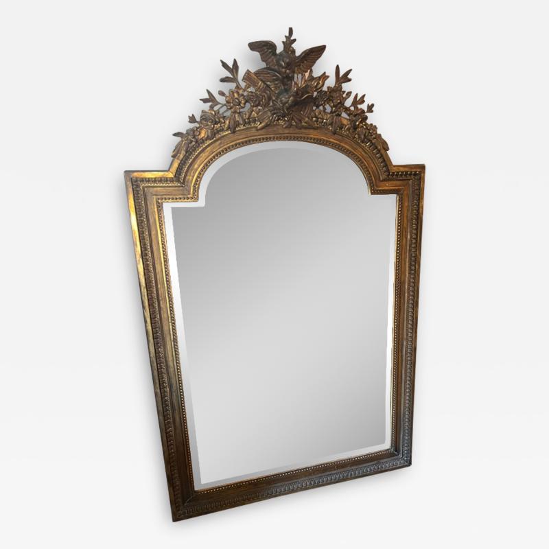 GRAND 19TH CENTURY GILTWOOD MIRROR WITH BIRD ARROWS TORCH CREST