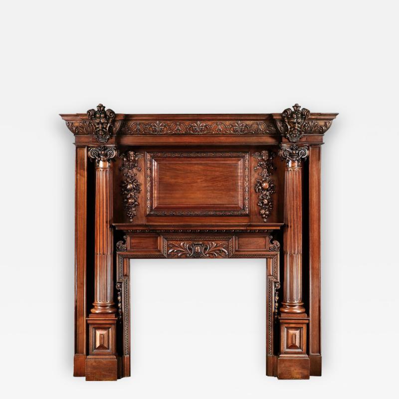 GRAND ANTIQUE 19TH CENTURY CARVED WALNUT FIRE SURROUND