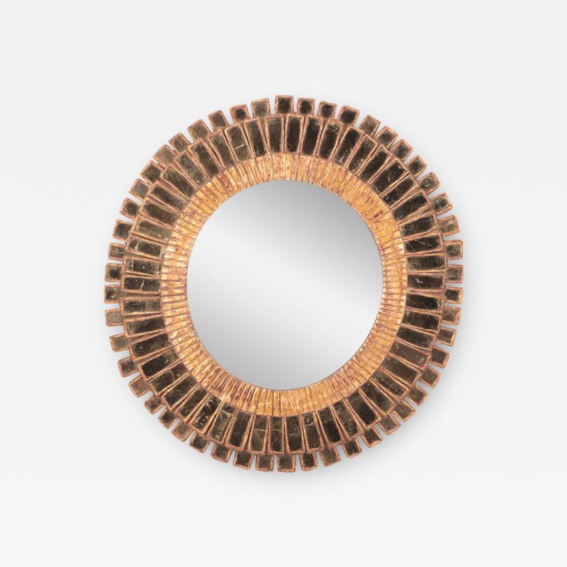 Gold Glass and resin sunburst mirror in the manner of Line Vautrin