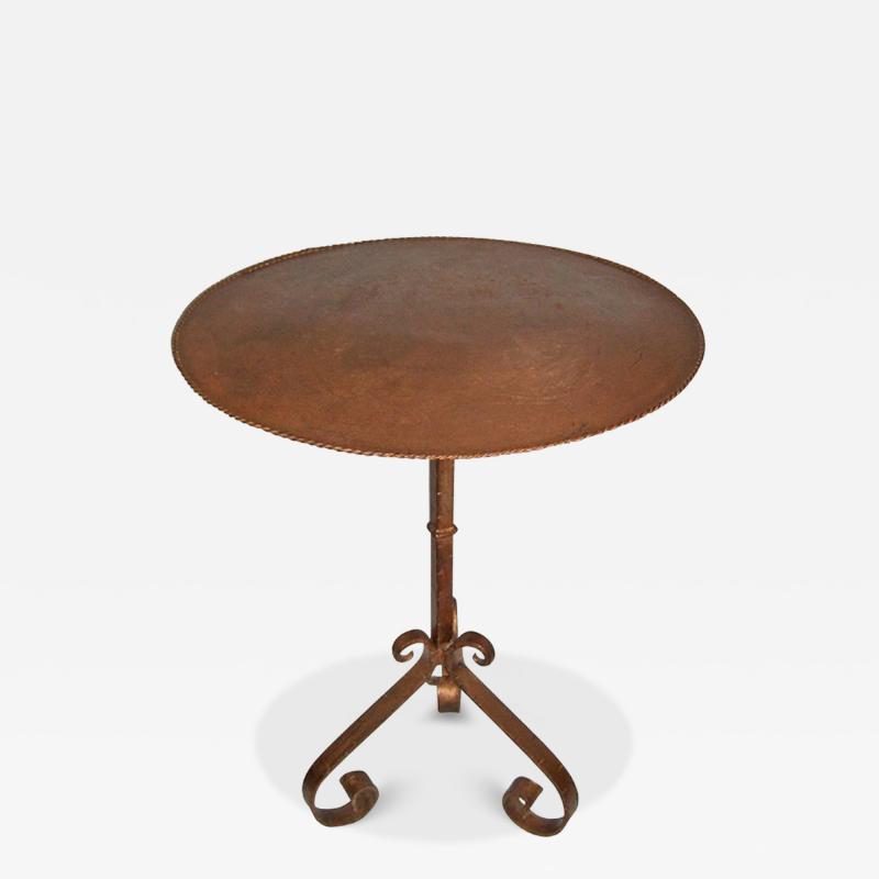 HANDCRAFTED TABLE WITH PATINATED METAL TOP AND ANTIQUE IRON CANDLE STAND BASE