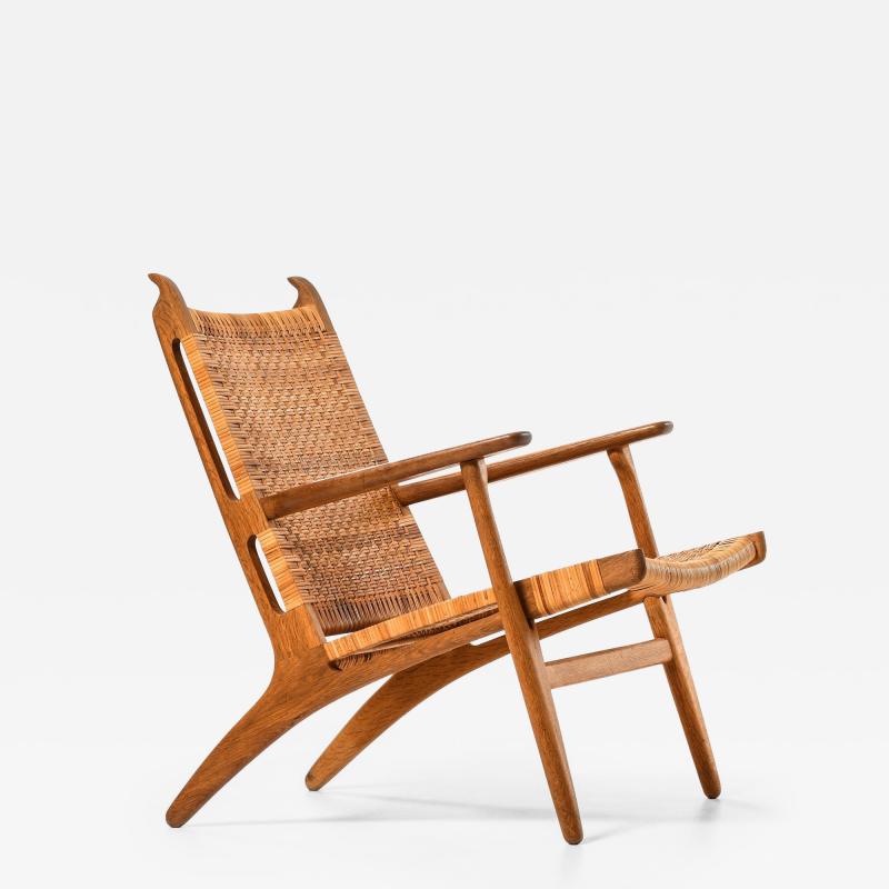 Hans Wegner Easy Chair in Cane and Oak by Hans Wegner 1949