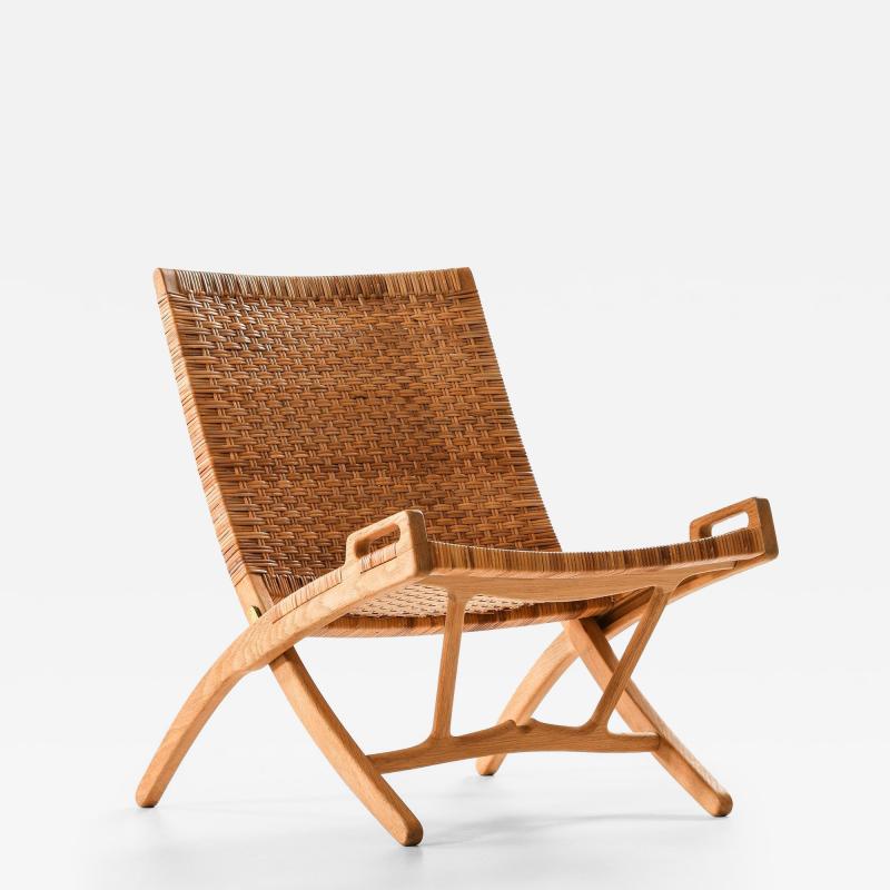 Hans Wegner Folding Easy Chair in Cane and Oak by Hans Wegner 1949