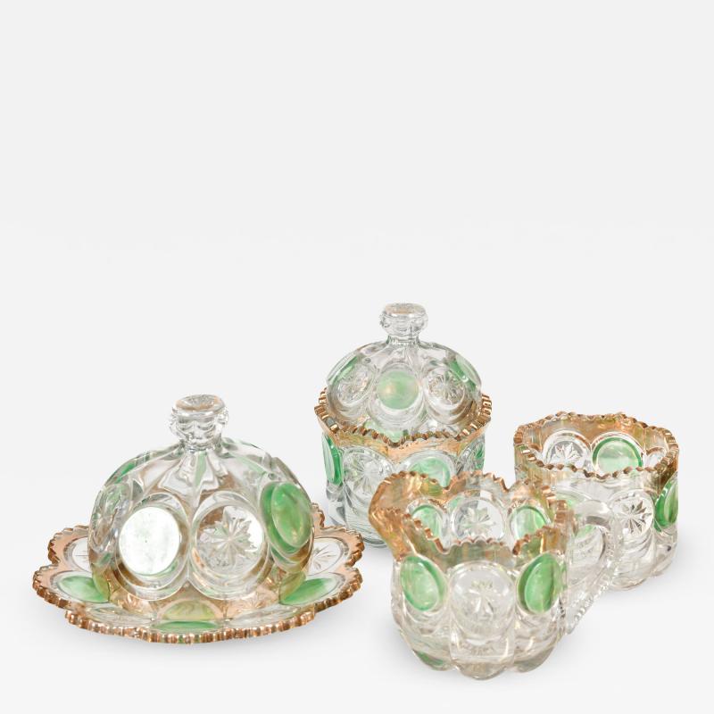 Highly decorative Continental cut glass table set detailed in green and gold