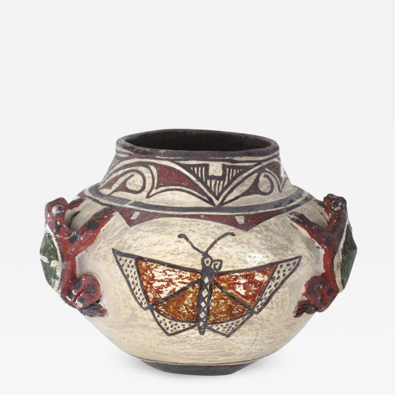 Historic Zuni jar with frogs and butterflies