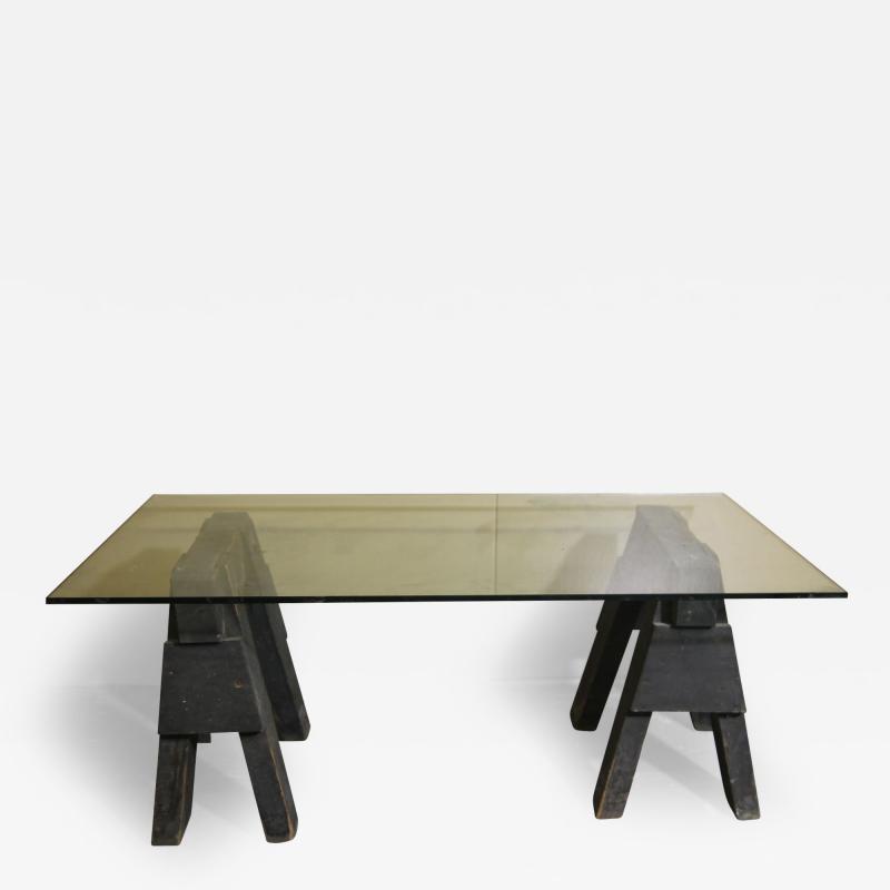 Industrial sawhorses and glass coffee table
